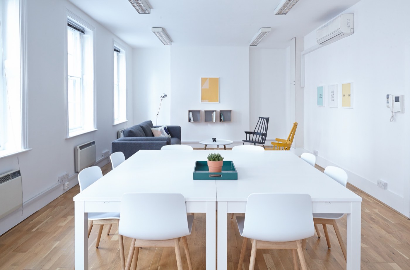 A leadership team reviews options around a boardroom table