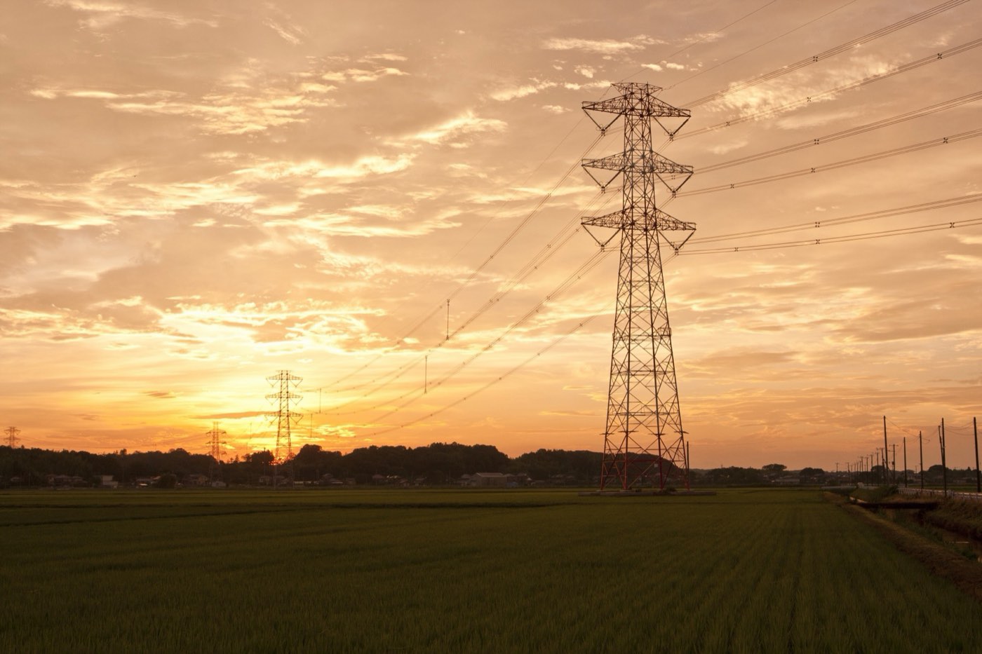 High-voltage transmission pylons at dusk