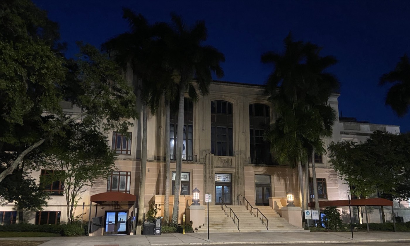 A city hall lit at night